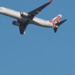 Utilice este título Terror en un vuelo de Australia a Qatar el 11 de septiembre por dos hombres que amenazaron a los pasajeros y tuvieron que ser inmovilizados con precintos plásticos y cree en base a ese titulo original un titulo nuevo, preciso, comprensible y que no pierda relacion con el titulo original. Necesito que me devuelvas solo y nada mas que el titulo nuevo.